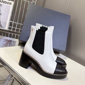 Chanel high-heeled mid-calf leather boots, black and white